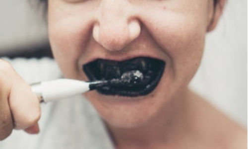 brushing teeth with charcoal