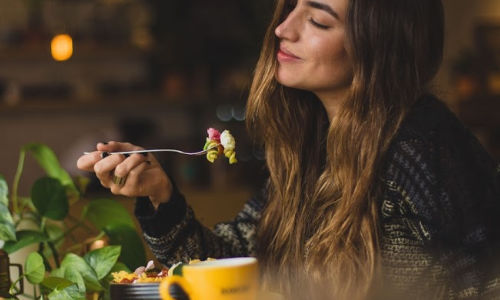 woman eating with fork