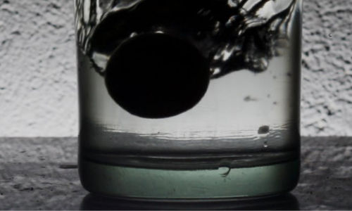 charcoal in glass of water