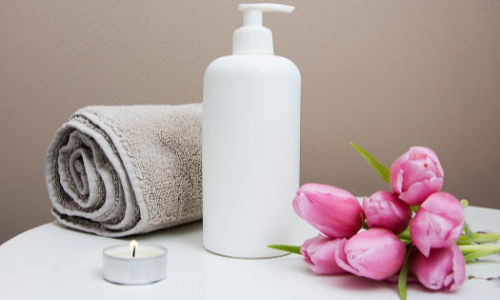 candle towel flowers spa setting