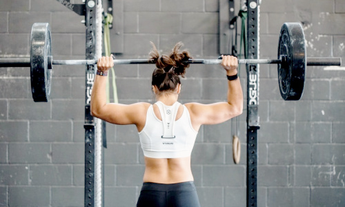woman exercising lifting weights