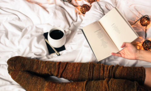 cozy reading book and drinking coffee