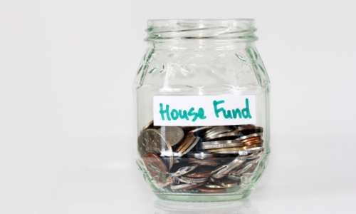 jar with coins labeled house fund