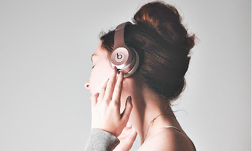 woman wearing headphones listening to musicng