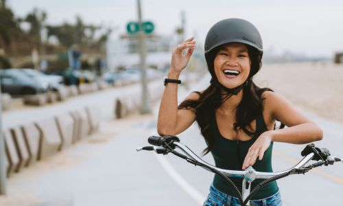 happy woman riding bike