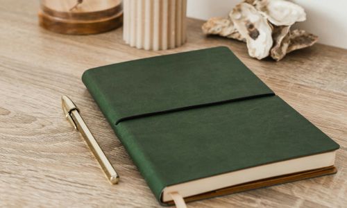 journal with pen on a table
