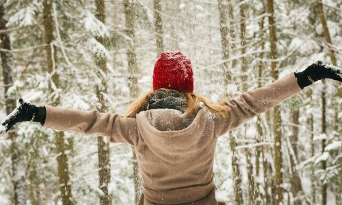 woman playing in snow